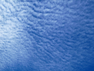 Cirrostratus Altocumulus clouds. Blue sky with white clouds. Beautiful sky background. Clear day, good weather.  Blue sky cloudy background. 
