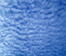Cirrostratus Altocumulus clouds. Blue sky with white clouds. Beautiful sky background. Clear day,...