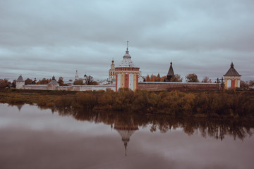 View of the Spassky Cathedral and the bell tower of the Spaso-Prilutsky monastery in Vologda from the rail road on a cloudy autumn day