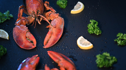 Red lobster with lemon and parsley, Selective focus.