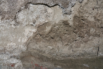 Obraz na płótnie Canvas Old concrete wall for background. Plaster with cracks. Spots of gray.