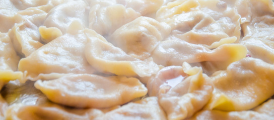 varenyky pierogi dumplings ravioli with wild strawberry Ukrainian traditional food close-up