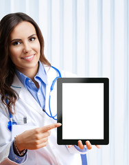 Portrait of happy smiling young female doctor showing no-name tablet pc with blank copyspace area...