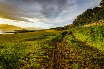 Fototapeta premium Beautiful scenic landscape of Scotland nature with beautiful evening sun set sky.