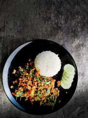 top view rice topped with stir fried minced pork and basil