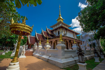 Naklejka premium background,Open view of the temple at Dara Pirom Temple (Mae Rim),which has a large statue in front of the temple. Covered by trees and sky, Chiang Mai Province, Thailand, Wat Pa Daphirom