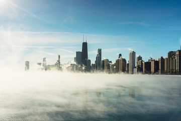 Fototapeta na wymiar Chicago Downtown and Lake Michigan covers by fog from winter polar vortex
