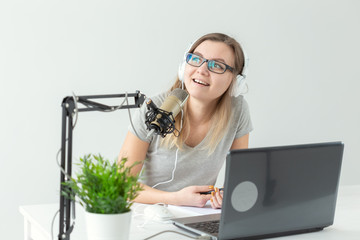 Podcasting, dj and broadcast concept - Presenter or host in radio station hosting show for radio