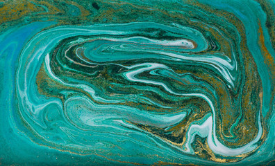 Green and gold ripple of agate background. Golden powder marble texture.