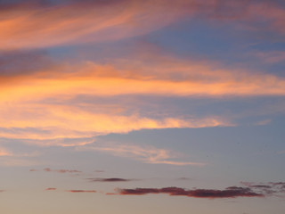 Fototapeta na wymiar Clouds on a sky background illuminated by the sun's rays of the setting sun