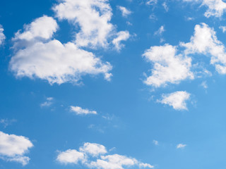 Obraz premium White clouds on a blue sky background