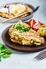Oatmeal omelet with cheese and sweet oatmeal pancake. Healthy breakfast concept.