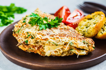 Oatmeal omelette with cheese and herbs. Healthy breakfast concept.