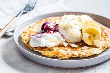 Sweet oatmeal omelet with banana and yogurt. Healthy breakfast concept.