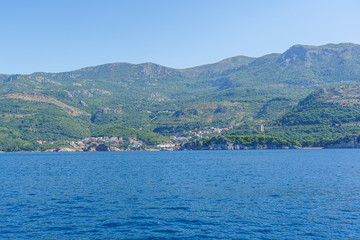 Budva Riviera in Montenegro, view from the sea on a summer day