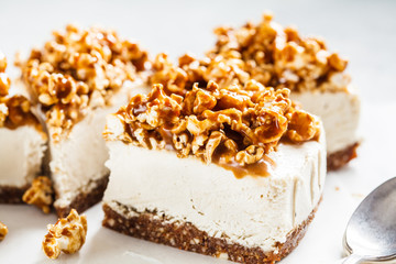 Raw vegan cashew cheesecake with caramel popcorn. Raw vegan dessert concept.