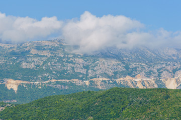 peaks and slopes of mountains covered with vegetation