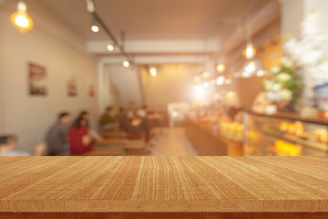 Wood table in blurry background with empty copy space for product display mockup