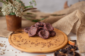 Sweets on a wooden tray around which are natural ingredients. Sugar-free dessert, healthy eating. Candies for diabetics.