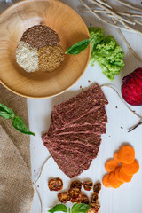 Ukrainian Crispbread  with beetroot and tomato. Healthy diet food. Bread cakes on a white background in the ingredient seasoning.