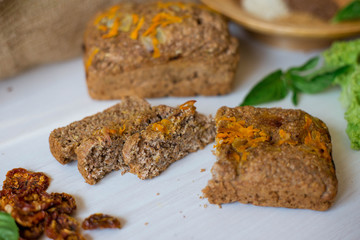 Dietary bread without yeast from whole grain flour. Healthy food, bread with vegetables and bran.