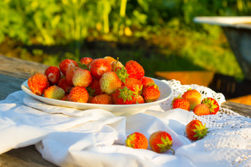 Red berries on a plate. Background.