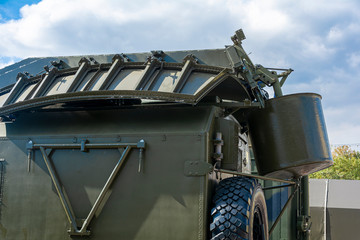 Folded green radar on a military vehicle. Close-up.