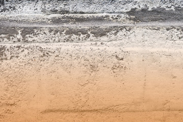 Old concrete surface close-up. Abstract background brown color toned
