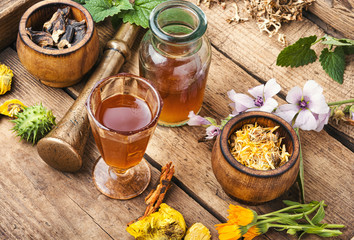 Bottles of tincture and healthy herb