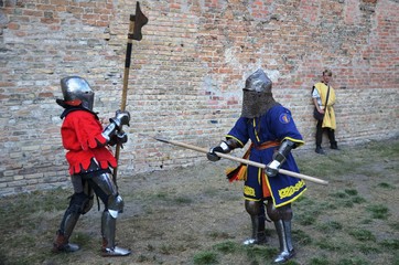 Lutsk, Ukraine, 09/01/2019. knights in armor battling halberds. reconstruction of medieval knightly...