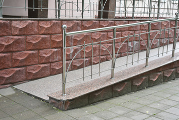 Stainless steel handrails for ramps for the disabled. Urban environment for the disabled.