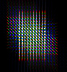 Obraz premium Photo of the diffraction pattern of LED array light, comprising a large number of diffraction orders obtained by the thin phase gratings