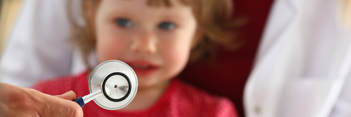 Little scared child at doctor reception make insulin shot. Physical exam cute baby aid healthy...