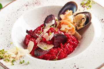 Red beetroot risotto with chrimps, prowns, mussels and parmesan cheese