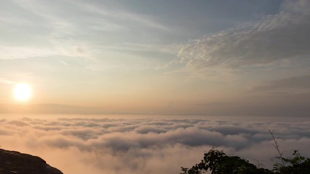 Time lapse of Morning mood and fog on mountain and sun with colorful clouds beatiful. Landscape sea fog and Sunrise Khao Phra Ya Dern Thong View Point. Phatthana Nikhom, Lopburi Thailand