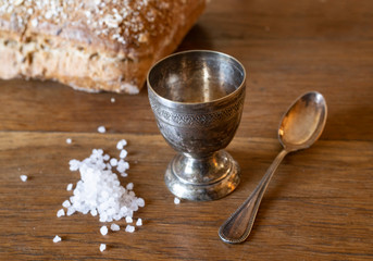 silver egg cup and egg
