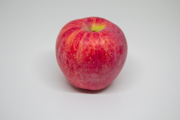 One red apple placed