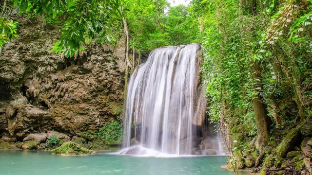 4K Timelapse of beautiful waterfall in tropical rain forest, soft water of the stream in the natural park at Erawan National Park in Kanchanaburi, Thailand