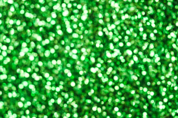 Green glitters. Green shiny abstract texture.