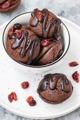 Chocolate chip cookies with chocolate smudges with cranberry jam