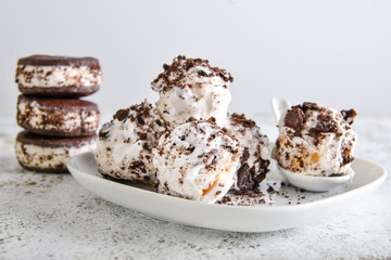 Plate with tasty ice cream on table