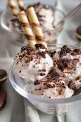 Bowl with tasty ice cream on table