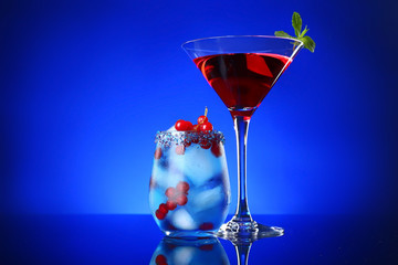 Different tasty cocktails on dark color background