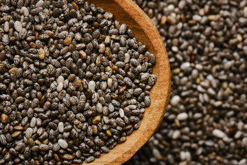 chia seeds in wooden spoon. chia seeds background