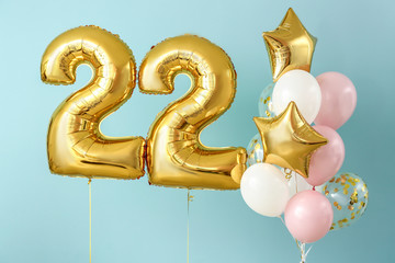 Figure 22 and different balloons on color background