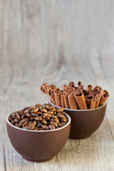 Two Cups With Cinnamon Sticks And Coffee Beans