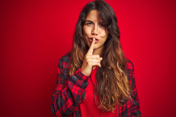 Naklejka premium Young beautiful woman wearing casual jacket standing over red isolated background pointing fingers to camera with happy and funny face. Good energy and vibes.