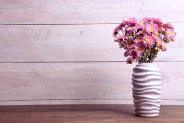 chrysanthemums in white vase