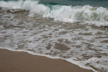 Kangaroo Island Australia, waves rushing over wet sand on Stokes Bay beach