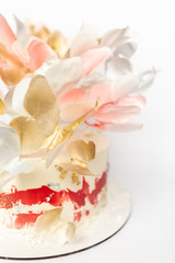 Fototapeta na wymiar A wedding cake. Festive white cake with butterflies.